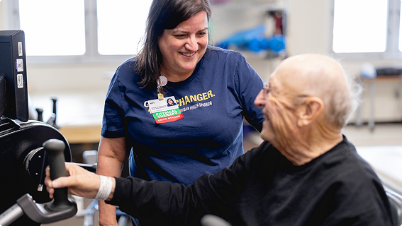 Mary Free Bed professional helps a stroke patient.
