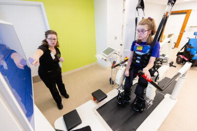 Lokomat machine being used by Cerebral Palsy patient with Mary Free Bed therapist
