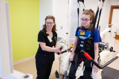 Cerebral Palsy patient using lokomat for therapy with Mary Free Bed therapist