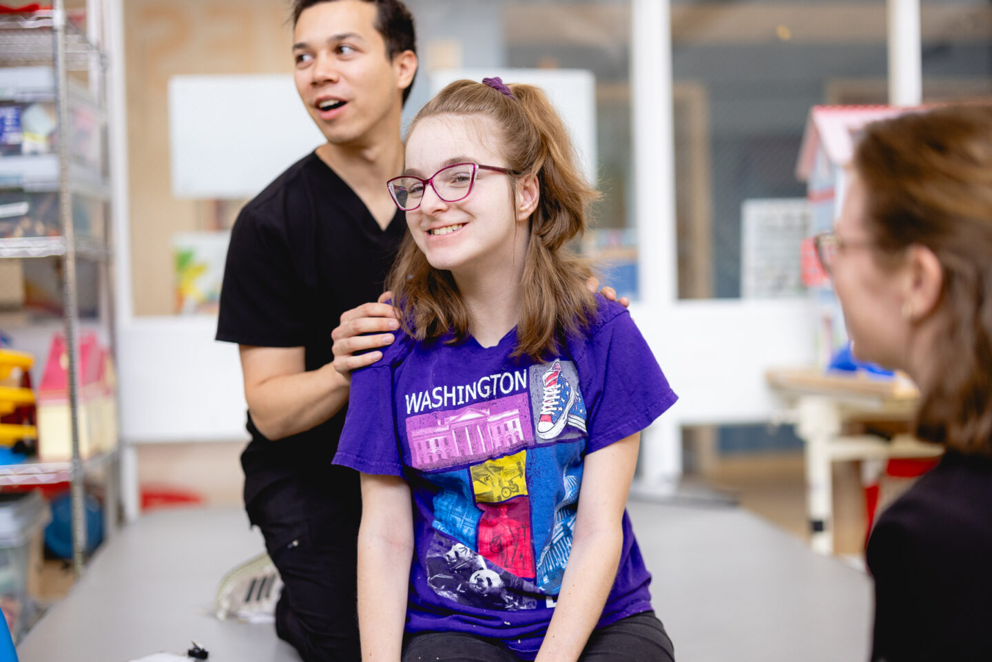 cerebral palsy patient shown smiling with Mary Free Bed therapist