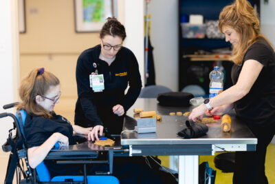 cerebral palsy patient doing therapy exercises with Mary free bed therapist