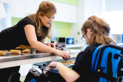 cerebral palsy patient doing therapy exercises with Mary free bed therapist