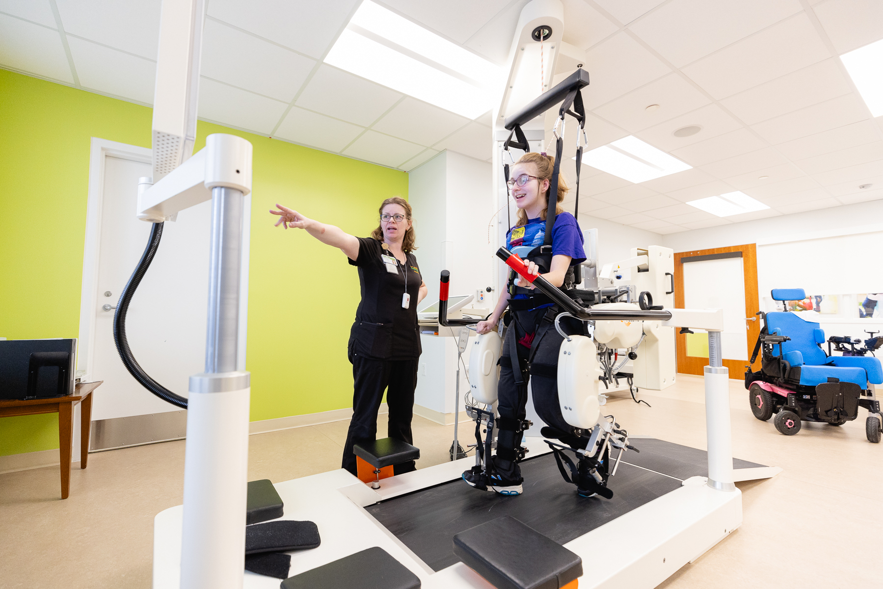 Patient using lokomat technology to assist in walking therapy