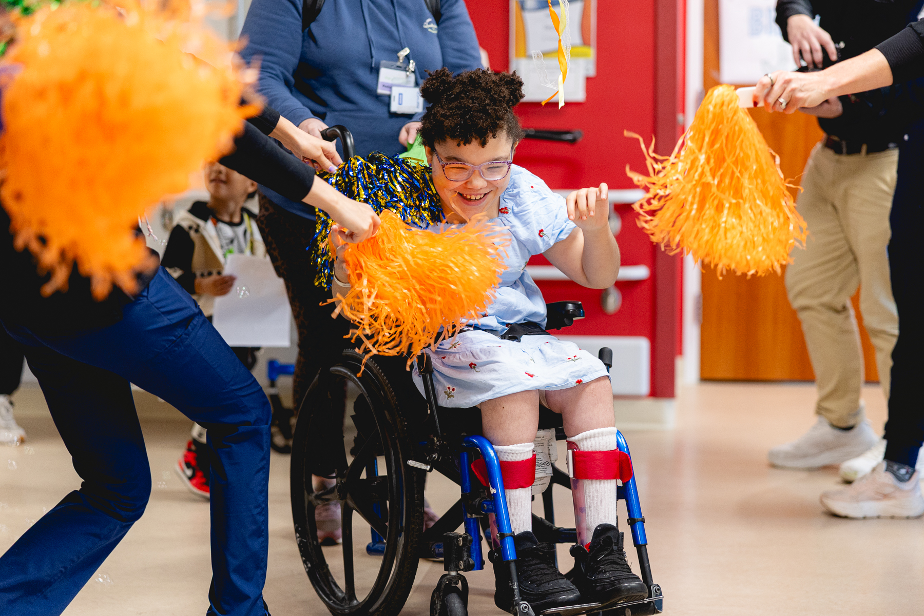 Pediatric patient shown smiling at their Mary Free Bed rehabilitation graduation