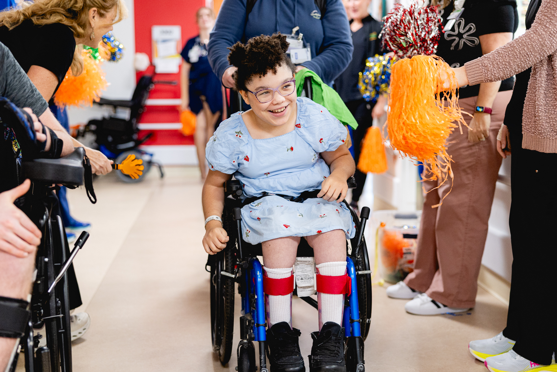 Pediatric patient shown smiling at their Mary Free Bed rehabilitation graduation