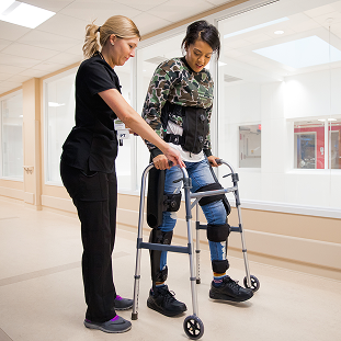 Brain Injury 40 Patient with a walker making progress after a spinal cord injury.