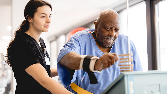 patient at trinity health performing therapy exercise