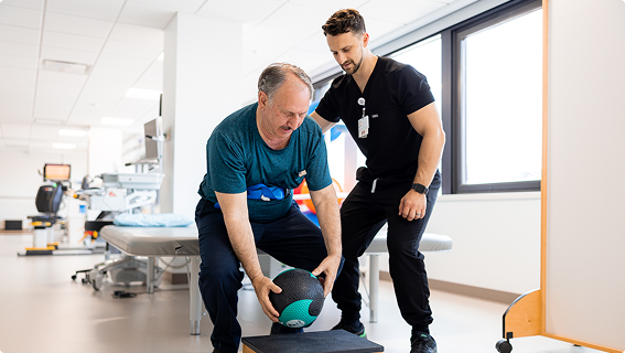 trinity health physical therapist and patient doing exercise