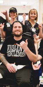 Andrew Tkaczyk, Ghost Inside drummer, with Mary Free Bed therapists