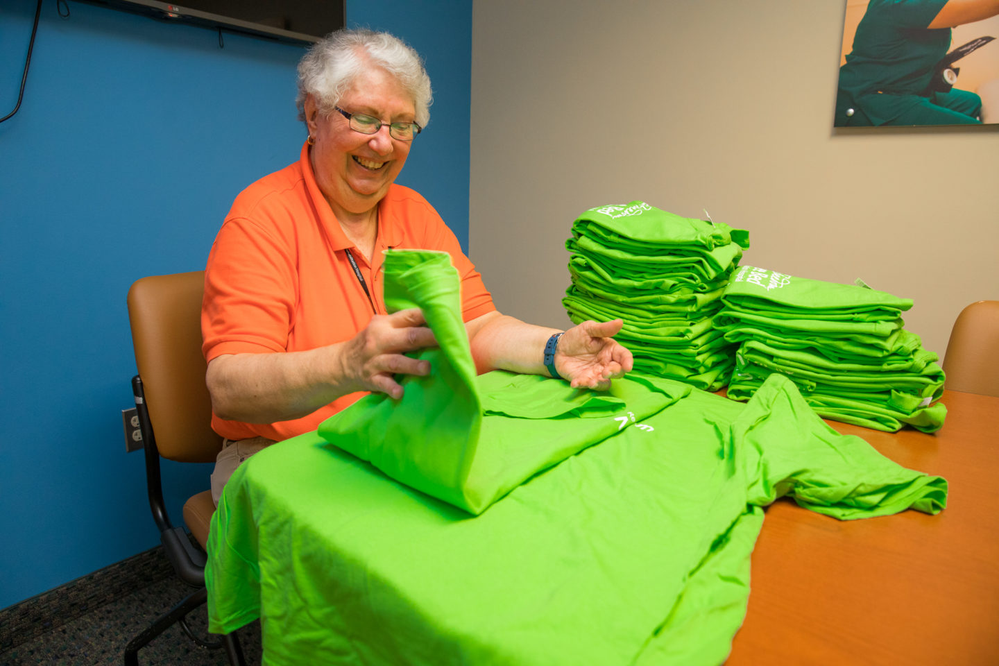 Volunteer folding shirts
