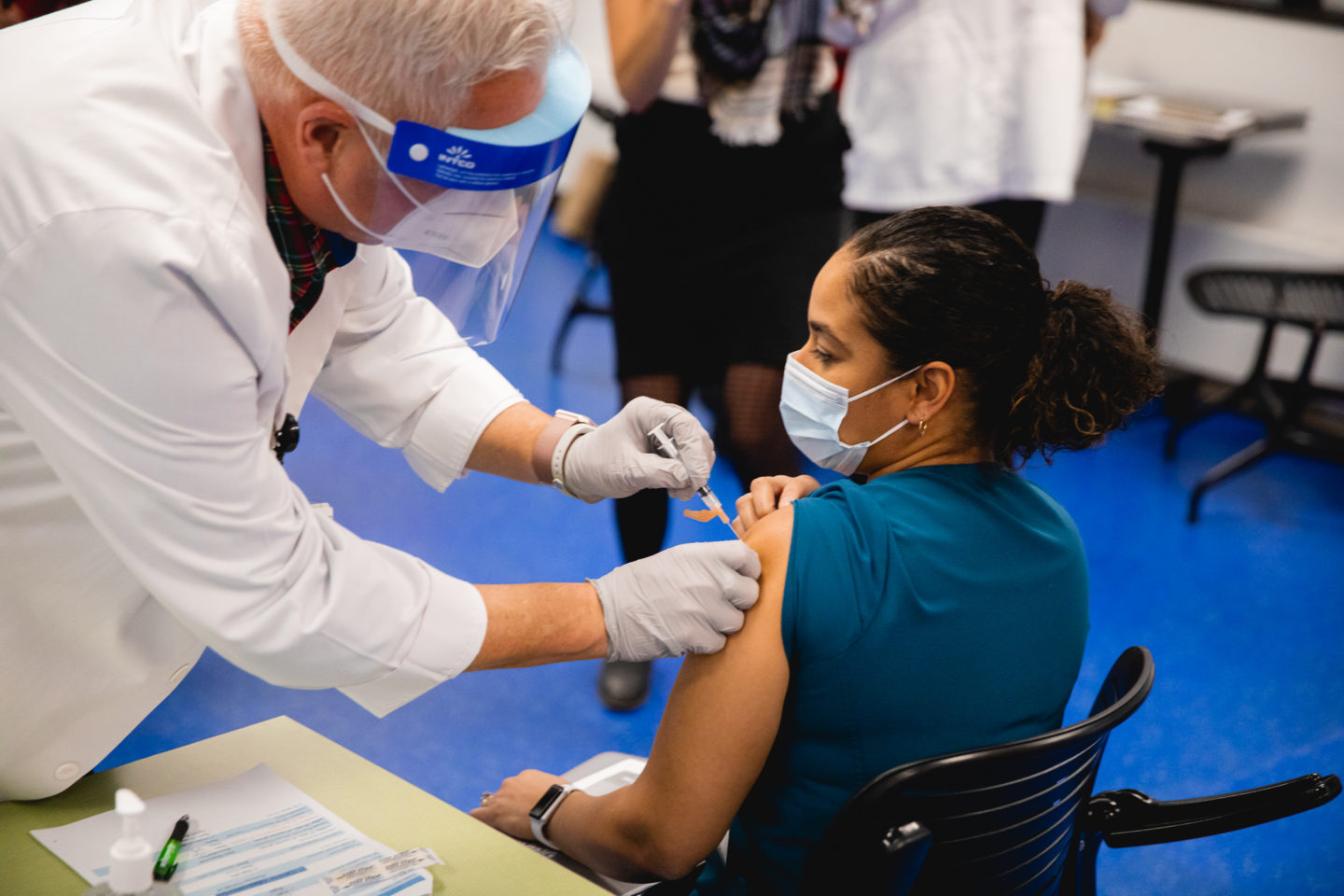 Staff receiving COVID vaccine