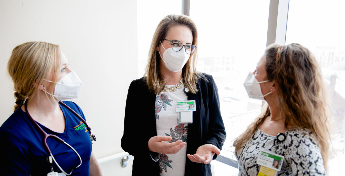 Kiersten Cudney, center, with Mary Free Bed Sub-Acute Rehabilitation staff