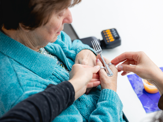 Hand therapy with a patient.