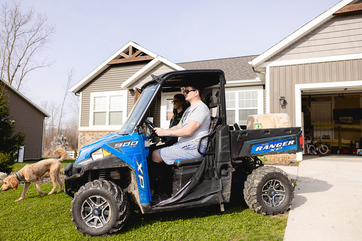 Patient and therapist driving a utility vehicle as part of job injury rehabilitation.