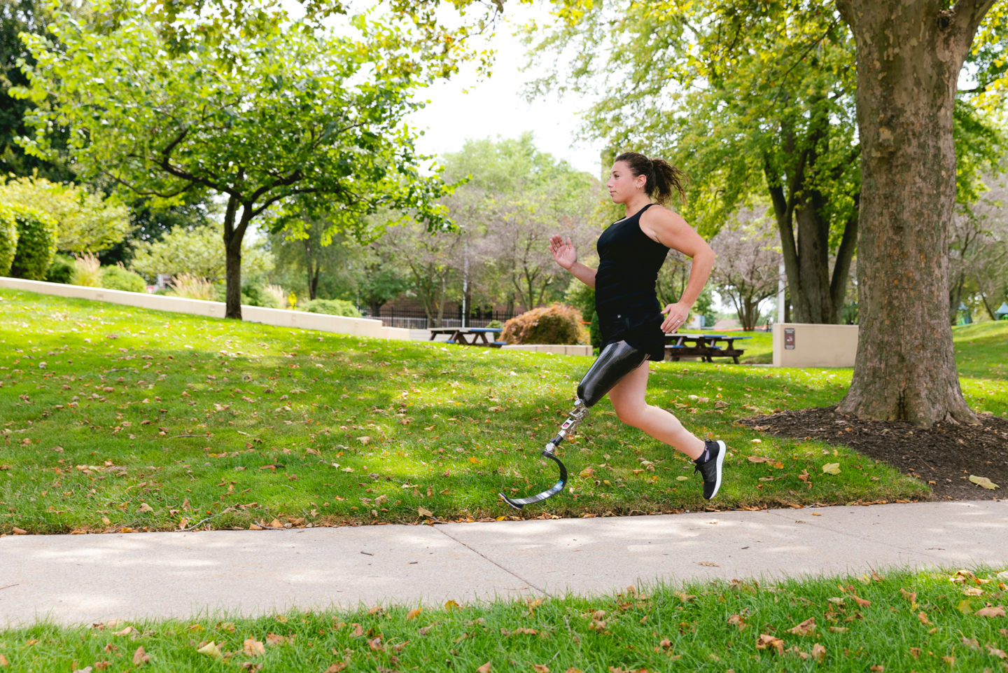 Alyssa Morse running with prosthetic blade