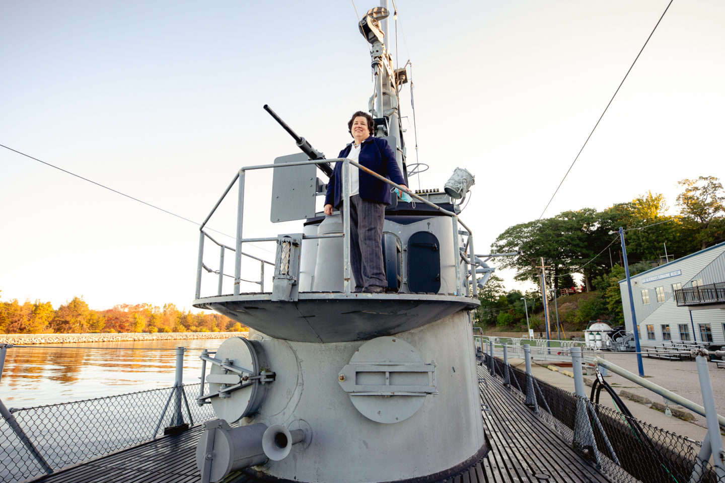 Peggy Maniates climbs ladder inside USS Silversides submarine