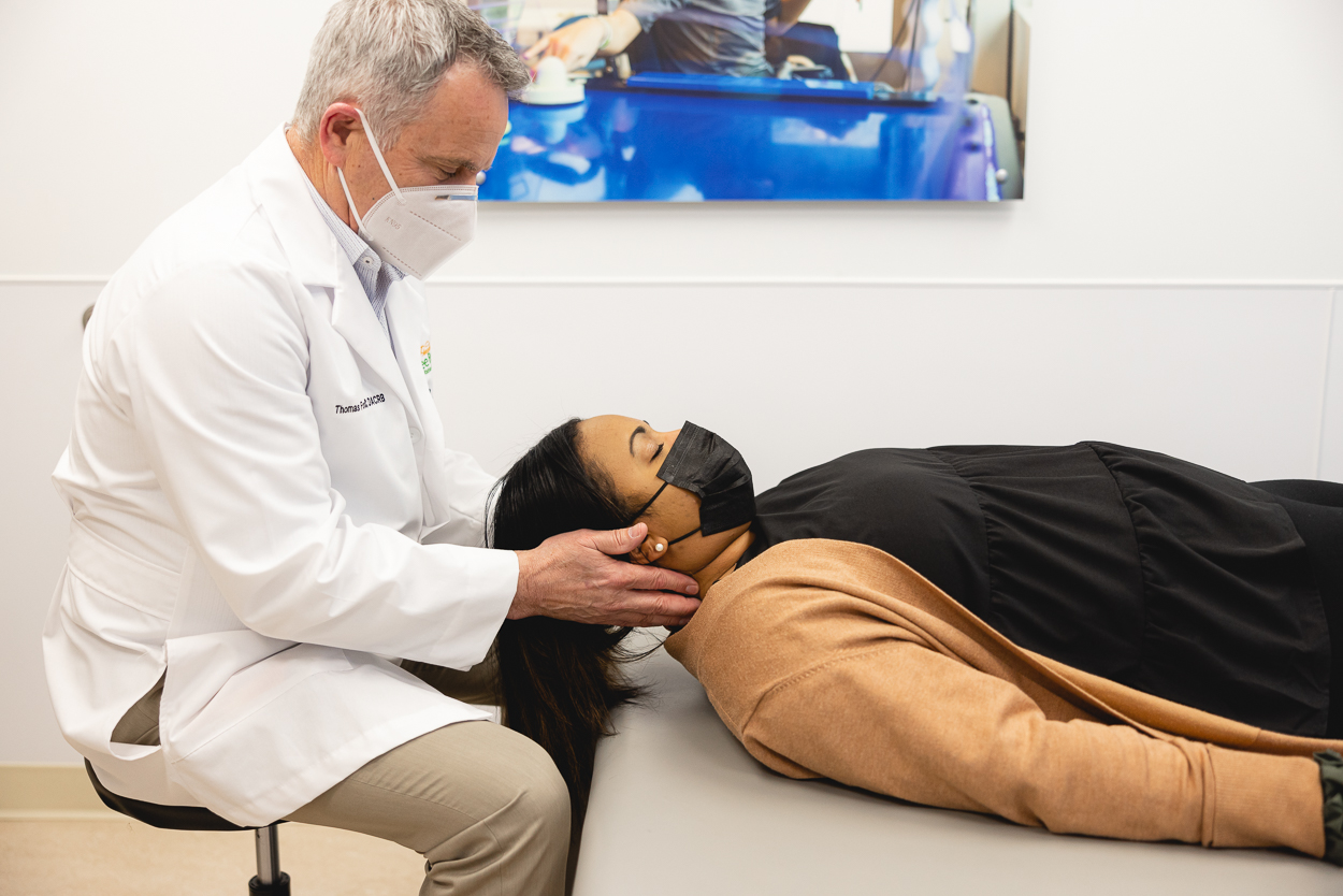 Tom Fowler, chiropractor, with patient