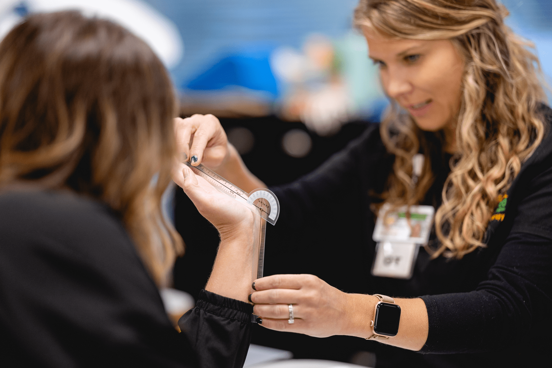 Occupational therapist working with a patient.