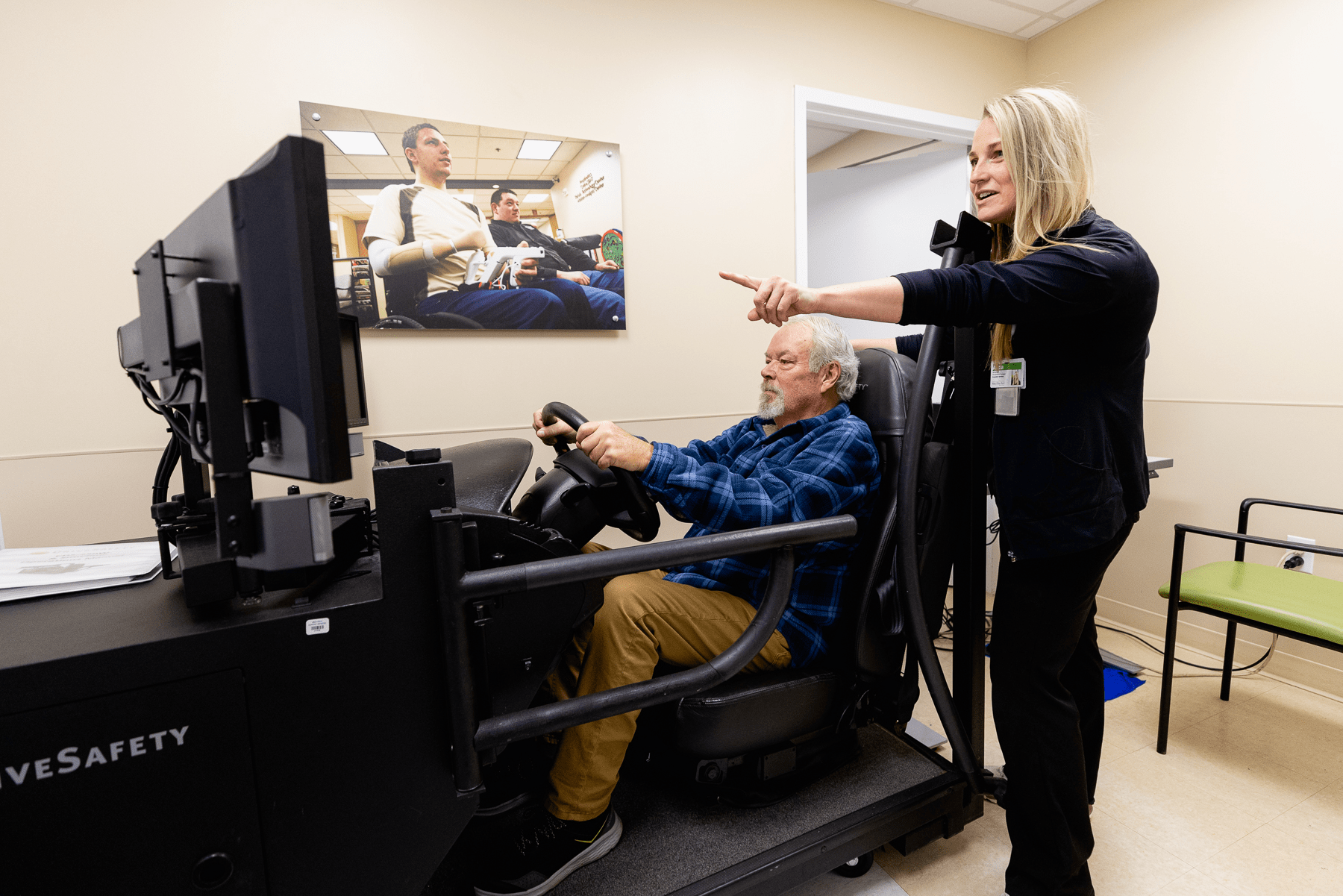 Occupational therapy in action - patient doing a driving simulation.