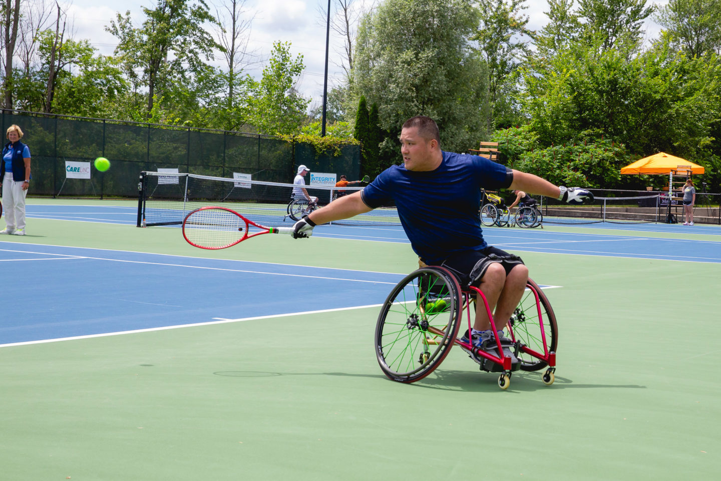 Man playing wheelchair tennis