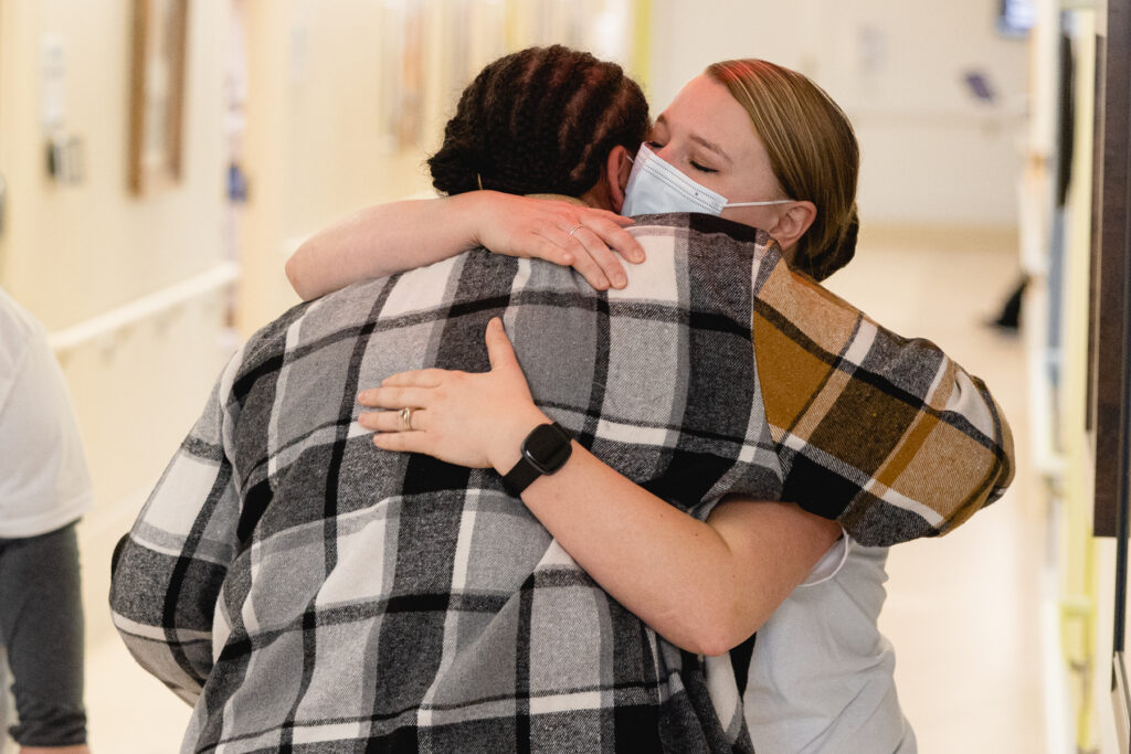 Destiny and Lavell's therapist happily embrace each other.