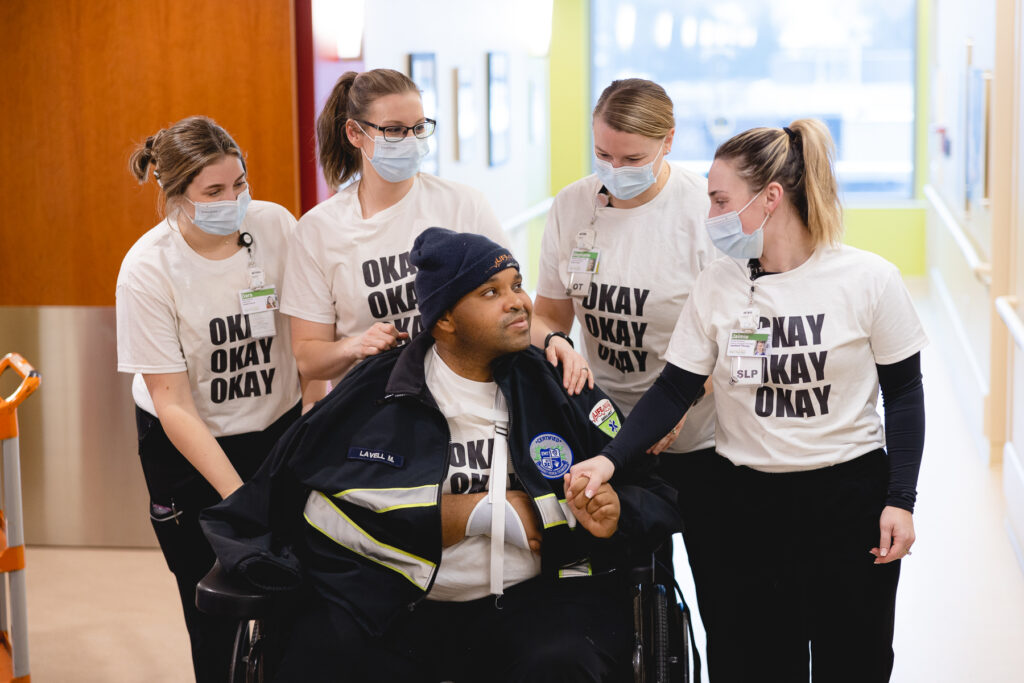 Lavell and his therapy team wearing the t-shirts Destiny made.