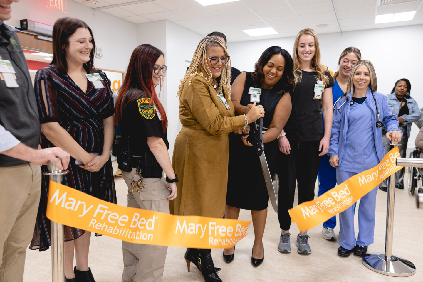 Hospital staff cut ribbon to new hospital floor