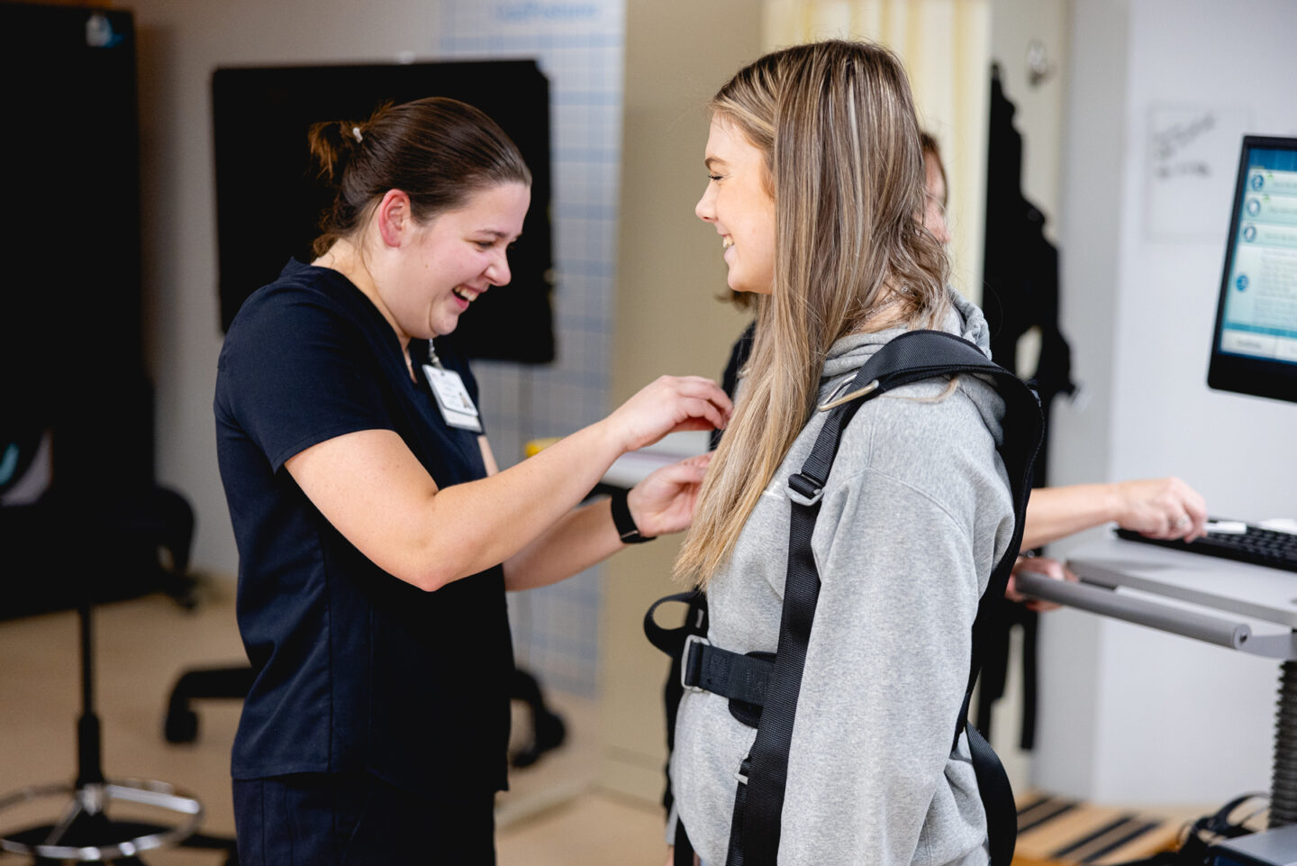 Patient being fitted for balance and dizziness evaluation.