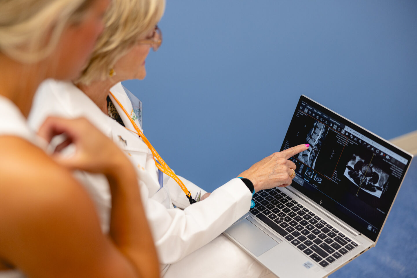 NP, Dr. Teri Holwerda, reviewing MRI results with patient at the Mary Free Bed Spine Center.