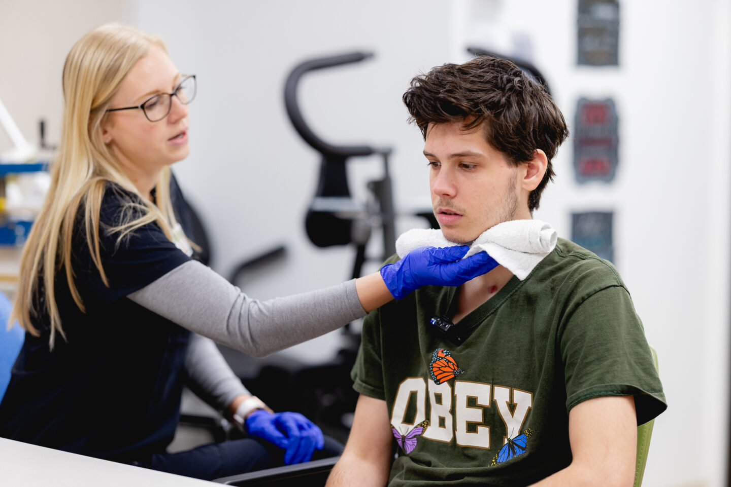 A patient works with a speech-language pathologist on communication skills improvement.
