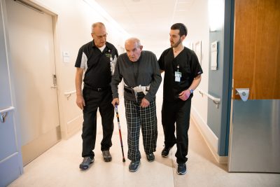 Former patient Anthony White overcomes odds to earn PTA degree 26 Anthony White with patient e1519833219532