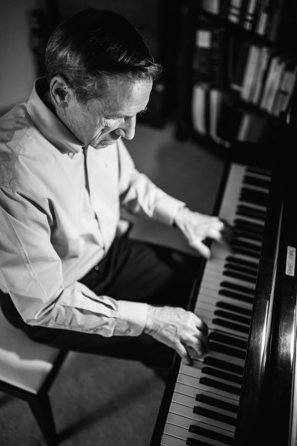 Dale Lamps playing piano black and white