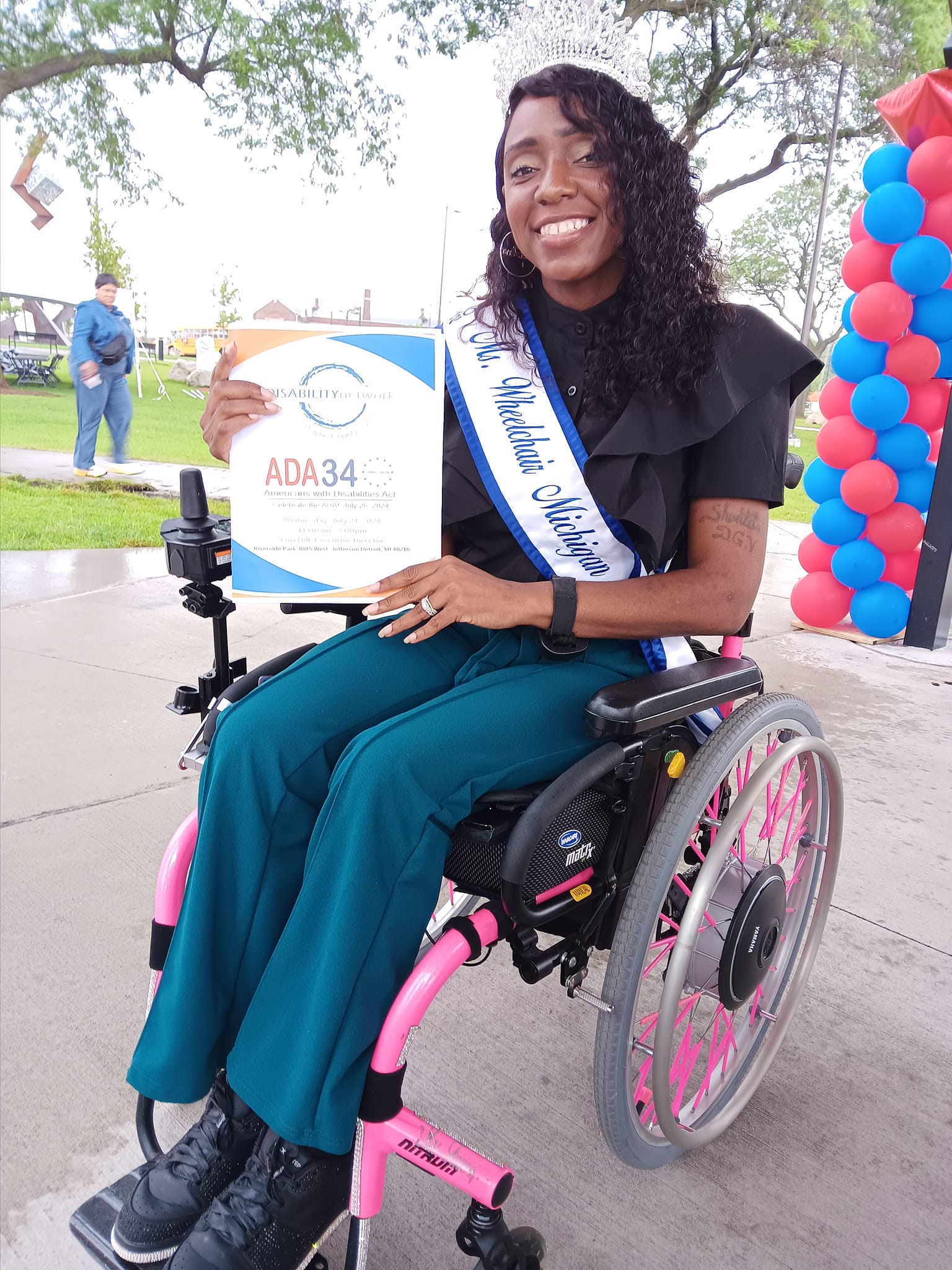 shanta favors holding ADA booklet at event