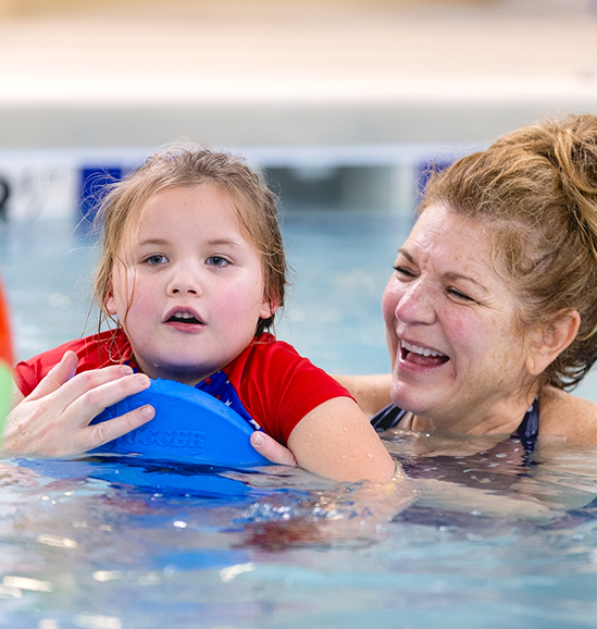 recreational therapist with patient in pool
