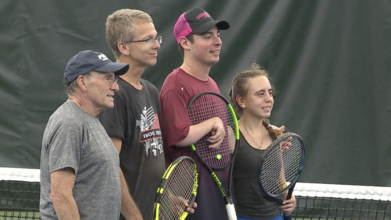 In The Media 26 Tennis players pose for a picture during the championship game.