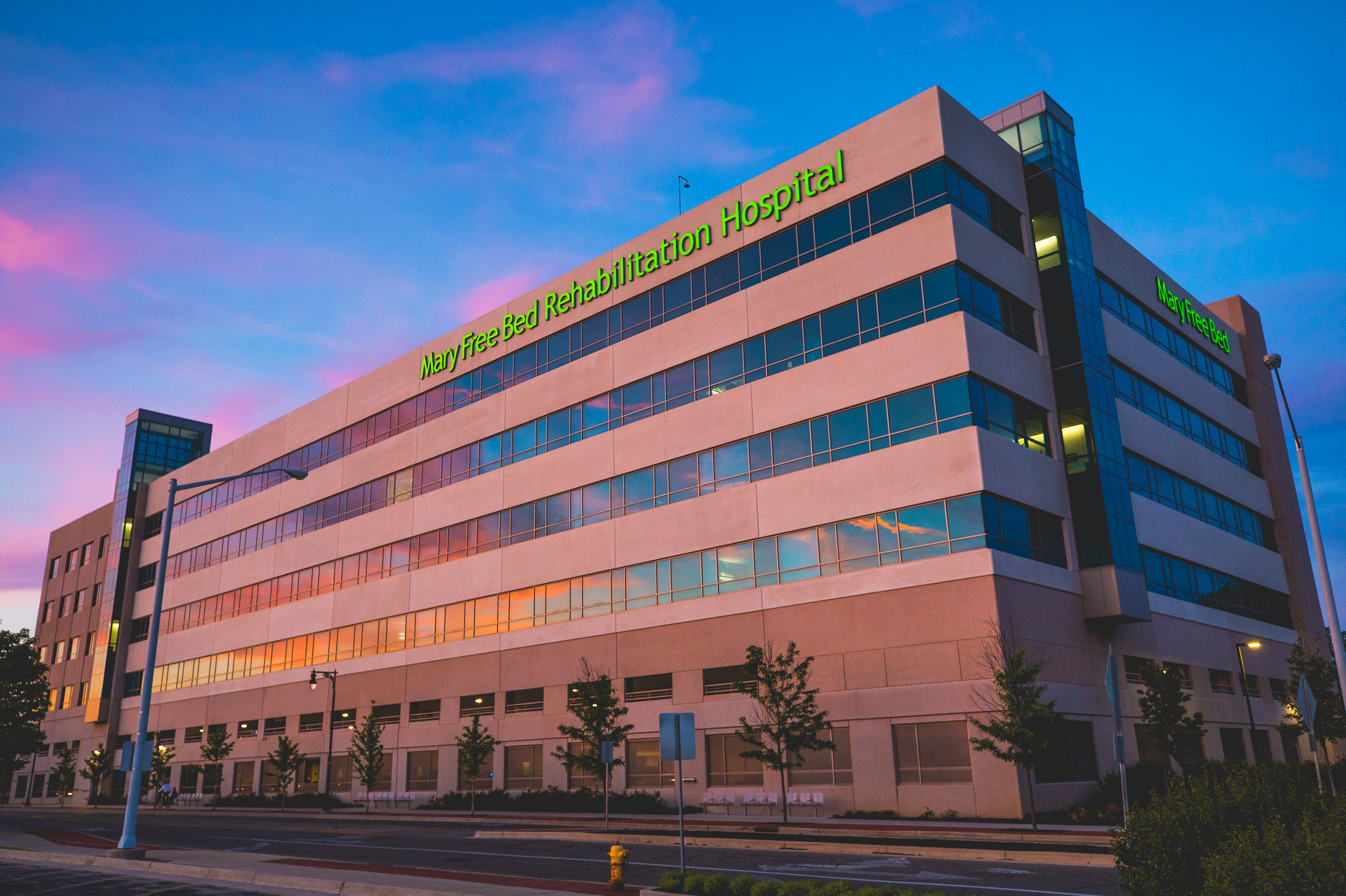 In The Media 82 West addition at Mary Free Bed hospital at sunset.
