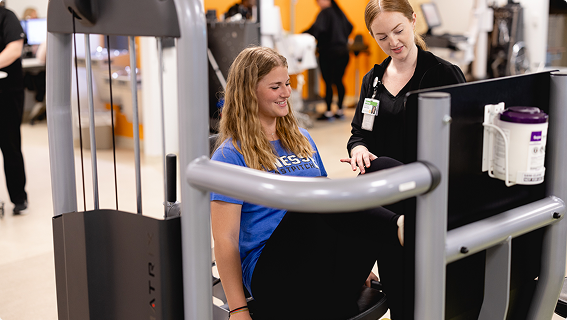 Professional at Mary Free Bed helping a patient with pain rehabilitation.