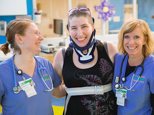 A patient with two respiratory therapy doctors at Mary Free Bed.