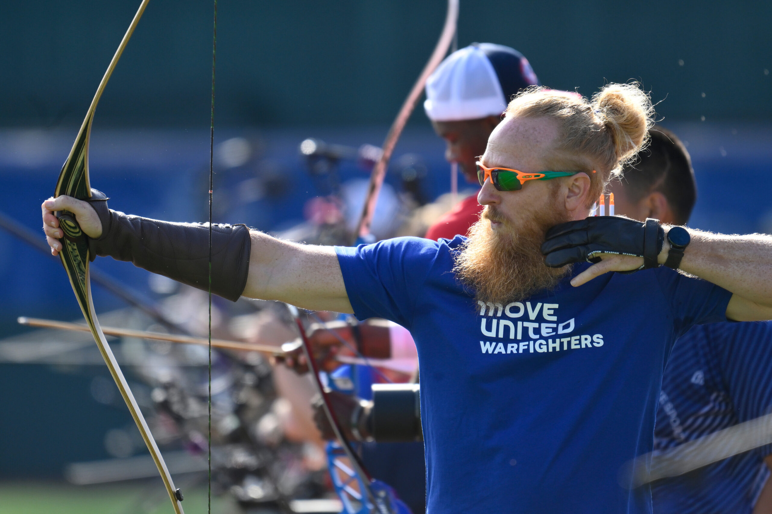 Man doing archery in The Hartford Nationals in Grand Rapids.