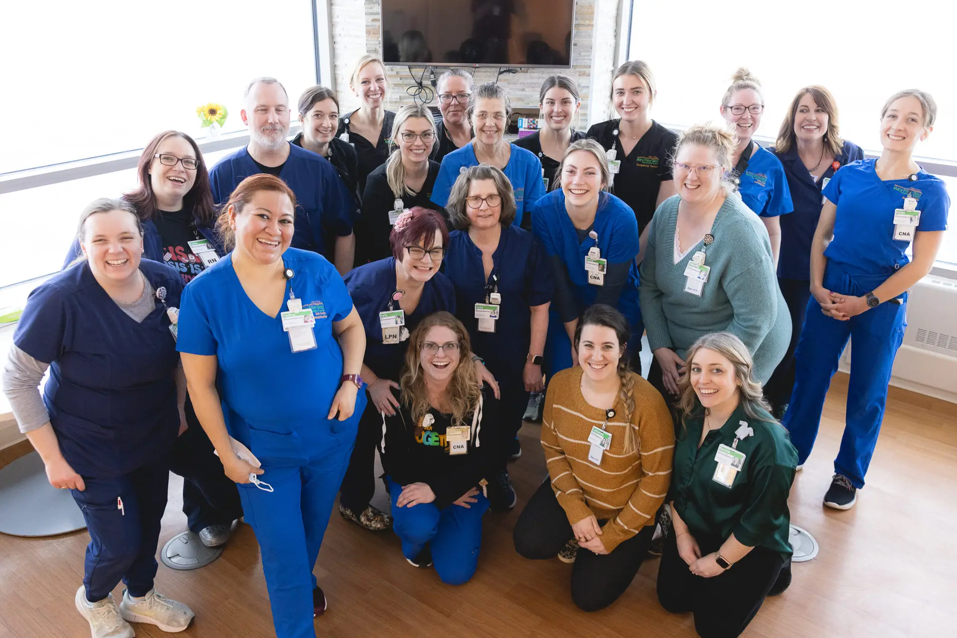 A group photo of SAR staff members and nurses.