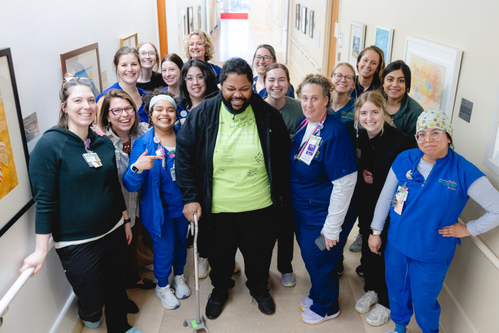 Mary Free Bed Multiple Trauma Patient at graduation with therapy team