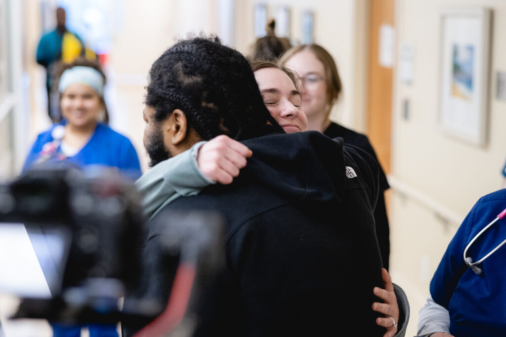 Mary Free Bed Multiple Trauma Patient at graduation with therapy team