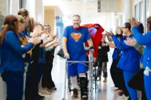 A patient walking through a graduation tunnel