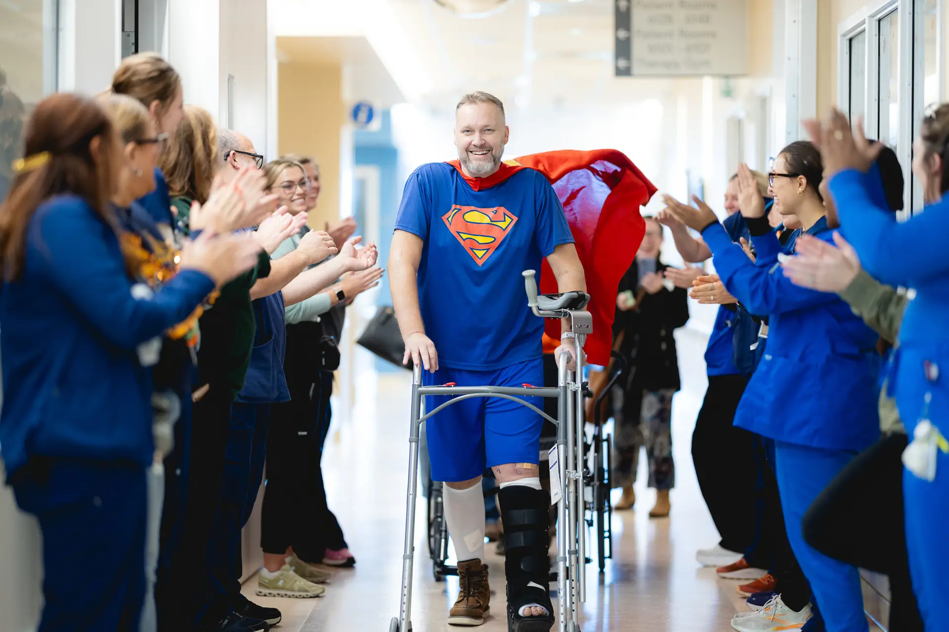 A patient walking through a graduation tunnel