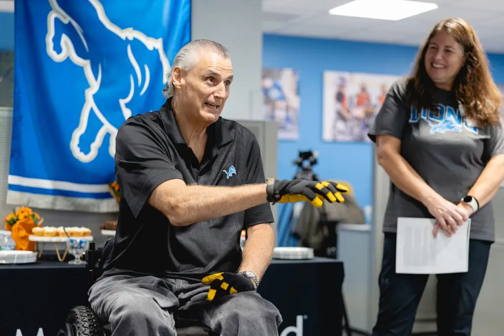 Mike Utley shown in wheelchair and adaptive sports office